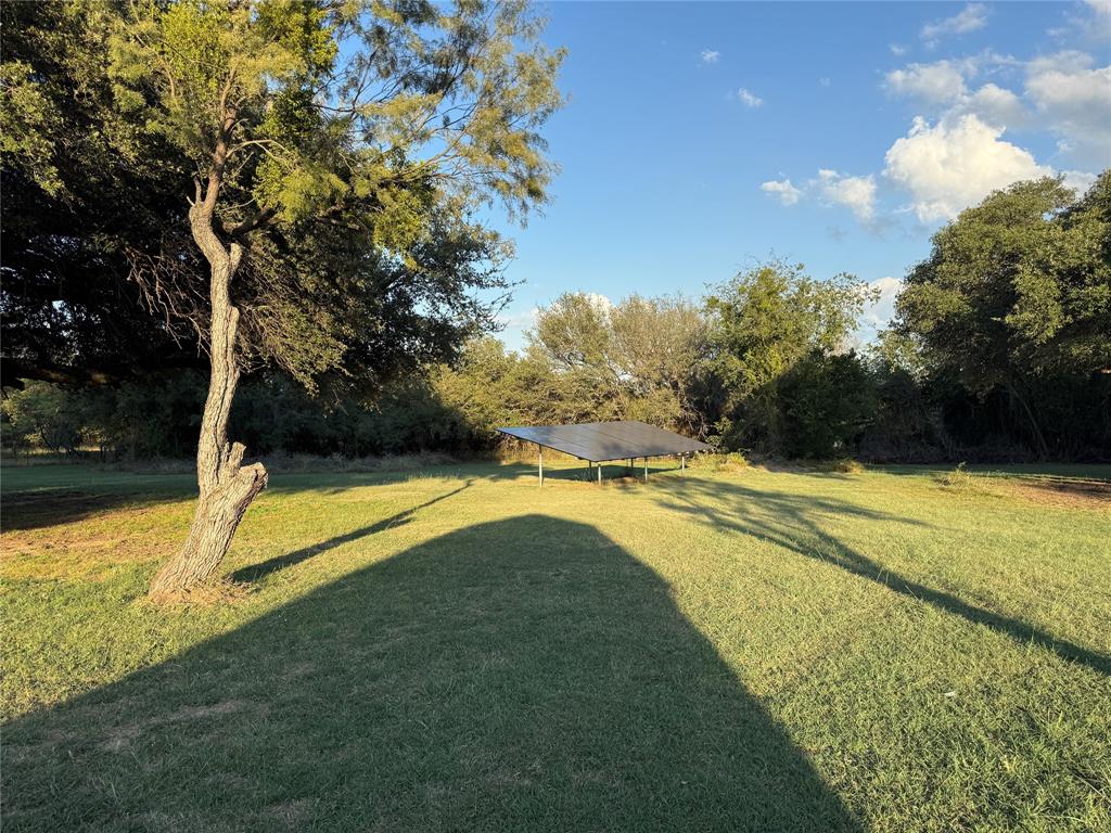 401 Highway 2247 Comanche, TX 76442 - Photo 18 of 19 a view of a swimming pool with an outdoor space and seating area