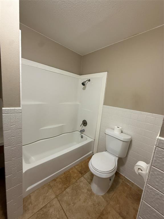 401 Highway 2247 Comanche, TX 76442 - Photo 10 of 19 a bathroom with a toilet and a shower