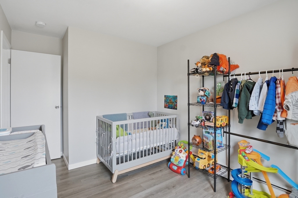 185 Davis Road Westminster, MA 01473 - Photo 18 of 36 a bedroom with furniture and baby crib