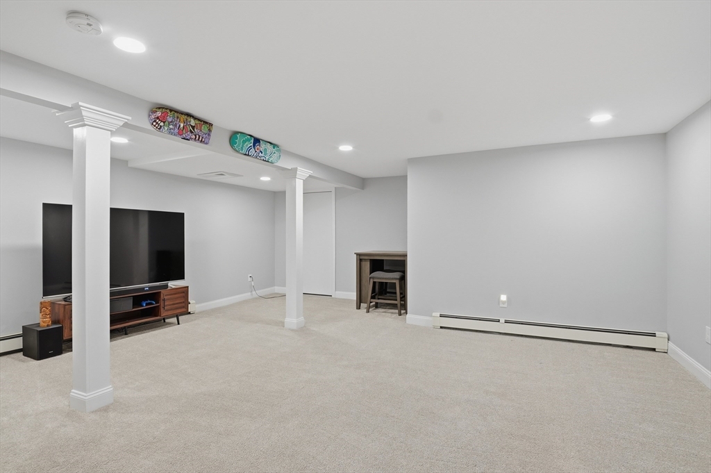 185 Davis Road Westminster, MA 01473 - Photo 24 of 36 an empty room with fireplace and mirrors