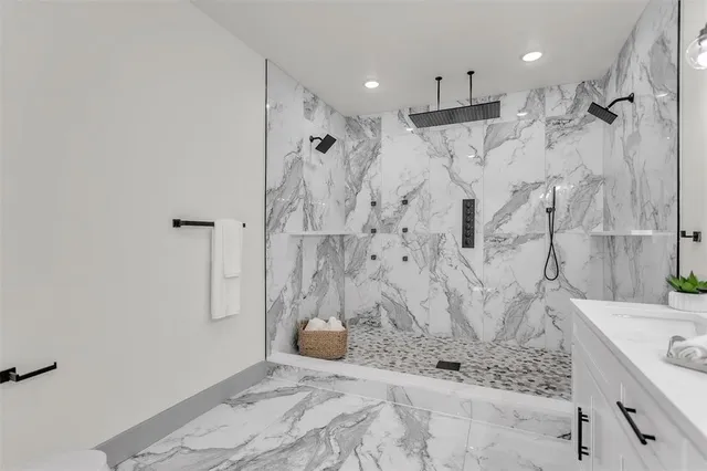 a bathroom with a bathtub sink and shower