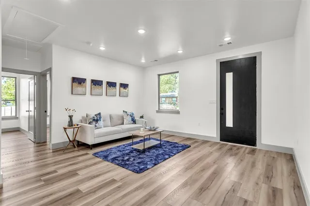 a living room with furniture and a rug