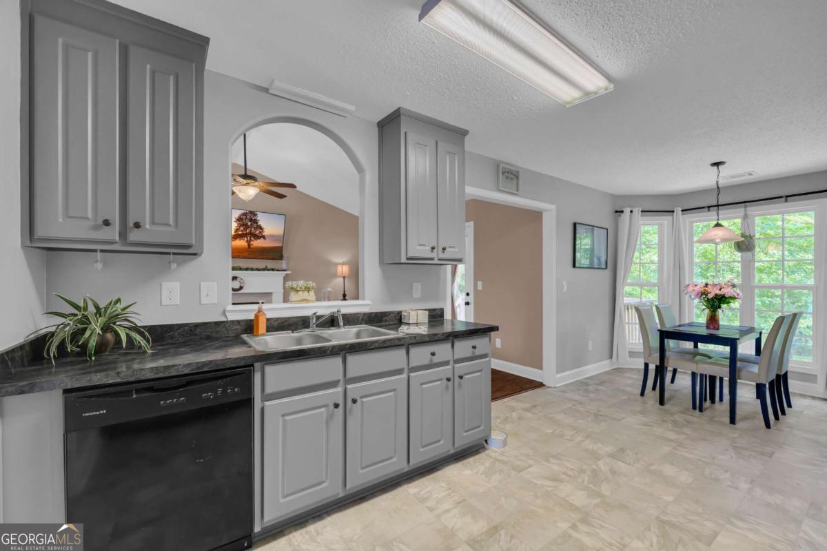 335 Elizabeth Court Colbert, GA 30628 - Photo 10 of 33 a kitchen with appliances cabinets and chair