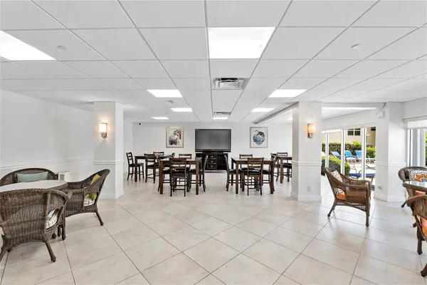 a room with lots of chairs and mirrors