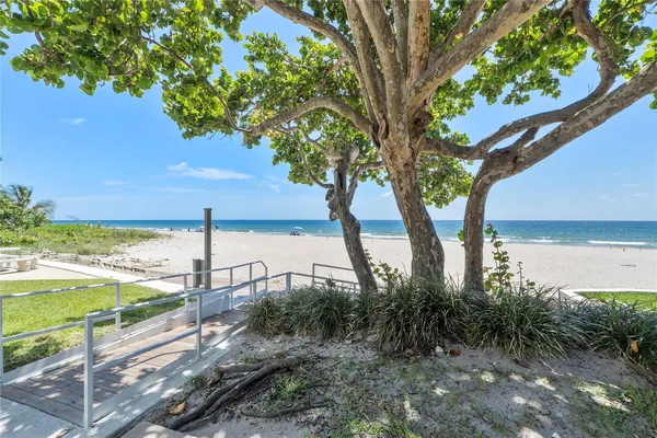 a view of a backyard with a ocean view