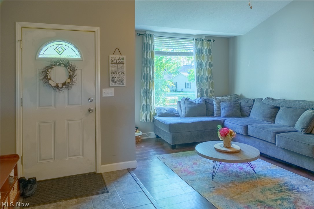 Entryway with hardwood / wood-style flooring