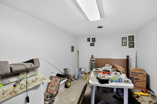 a view of a workspace with furniture and toys