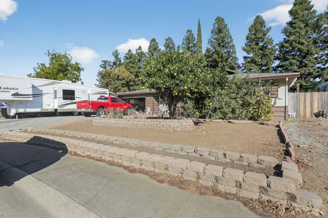 a view of street with small white house
