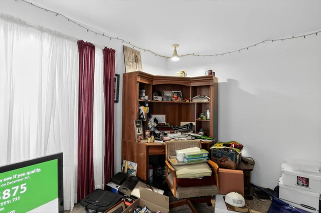 a room with furniture and a flat screen tv