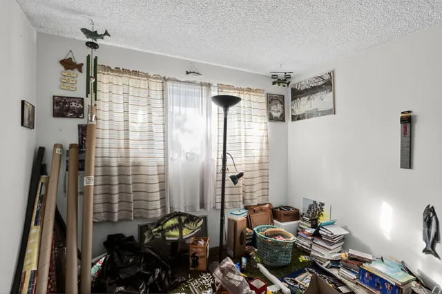 a bathroom with a sink mirror and shower