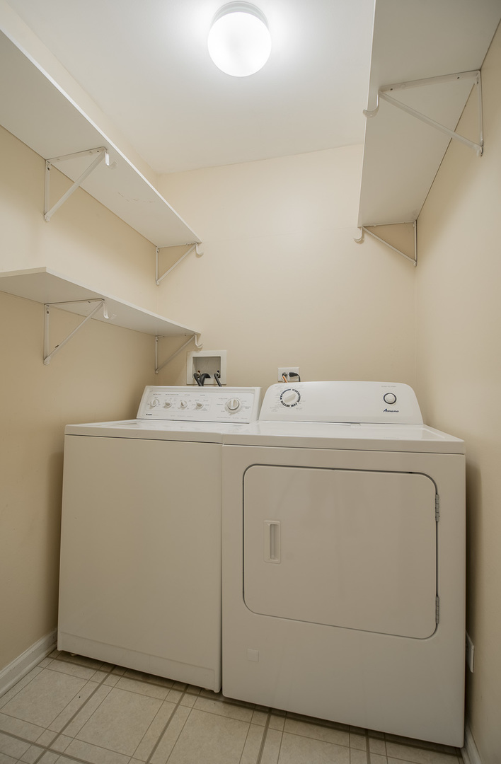 2891 Belle Lane, Unit 2891 Schaumburg, IL 60193 - Photo 14 of 25 a utility room with dryer and washer