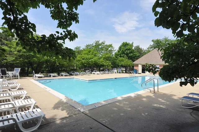 a view of a swimming pool with a patio