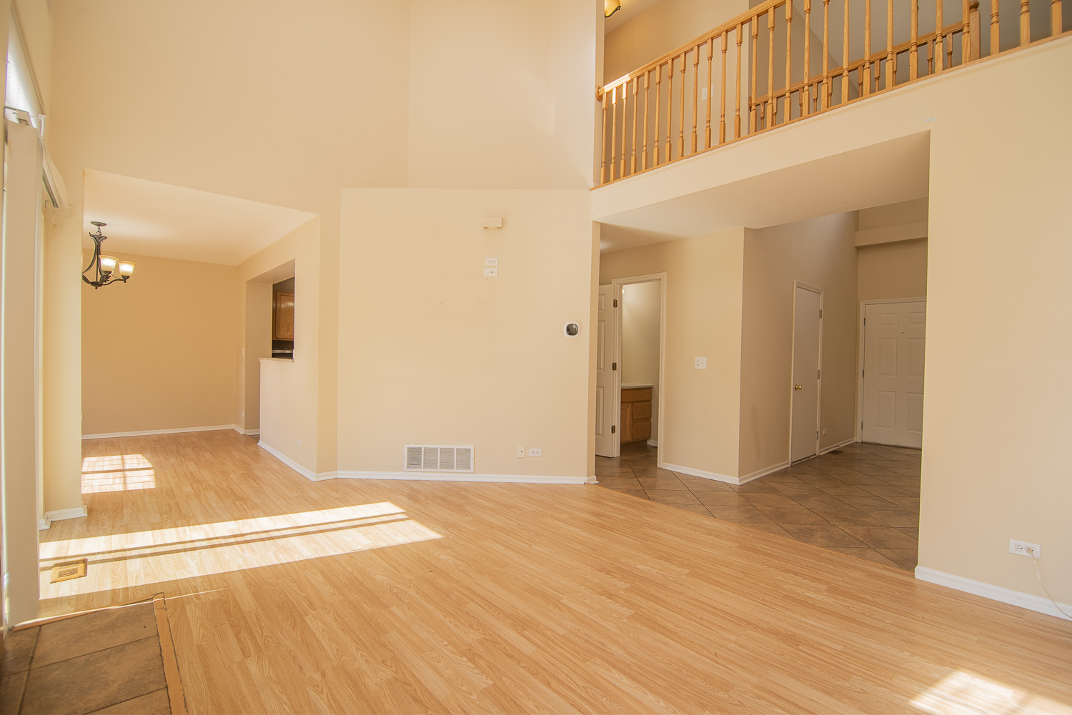 2891 Belle Lane, Unit 2891 Schaumburg, IL 60193 - Photo 3 of 25 a view of an empty room with wooden floor