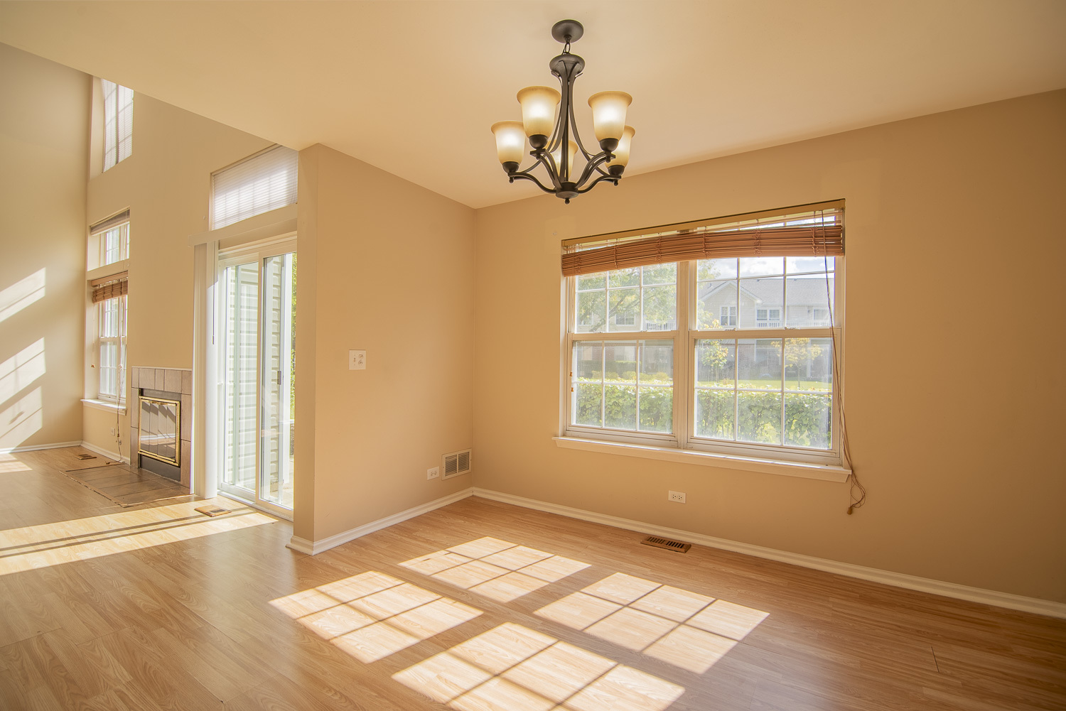 2891 Belle Lane, Unit 2891 Schaumburg, IL 60193 - Photo 6 of 25 a view of an empty room with wooden floor and a window