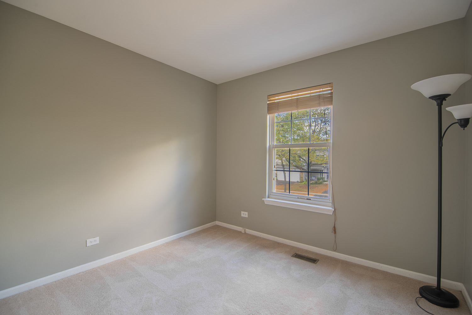 2891 Belle Lane, Unit 2891 Schaumburg, IL 60193 - Photo 10 of 25 an empty room with windows