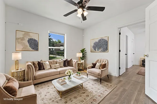 a living room with furniture and a rug