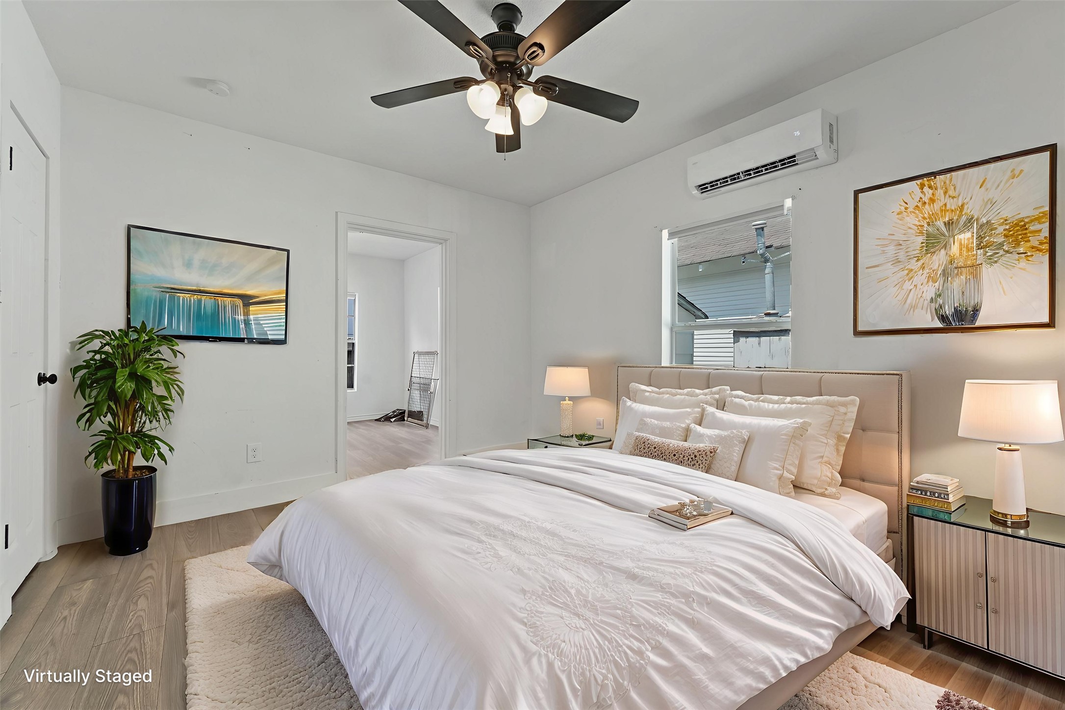 3019 Florida Street, Unit 3 Houston, TX 77026 - Photo 2 of 14 a bedroom with a balcony a bed and a chandelier
