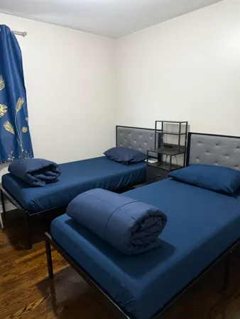 a living room with furniture and a lamp