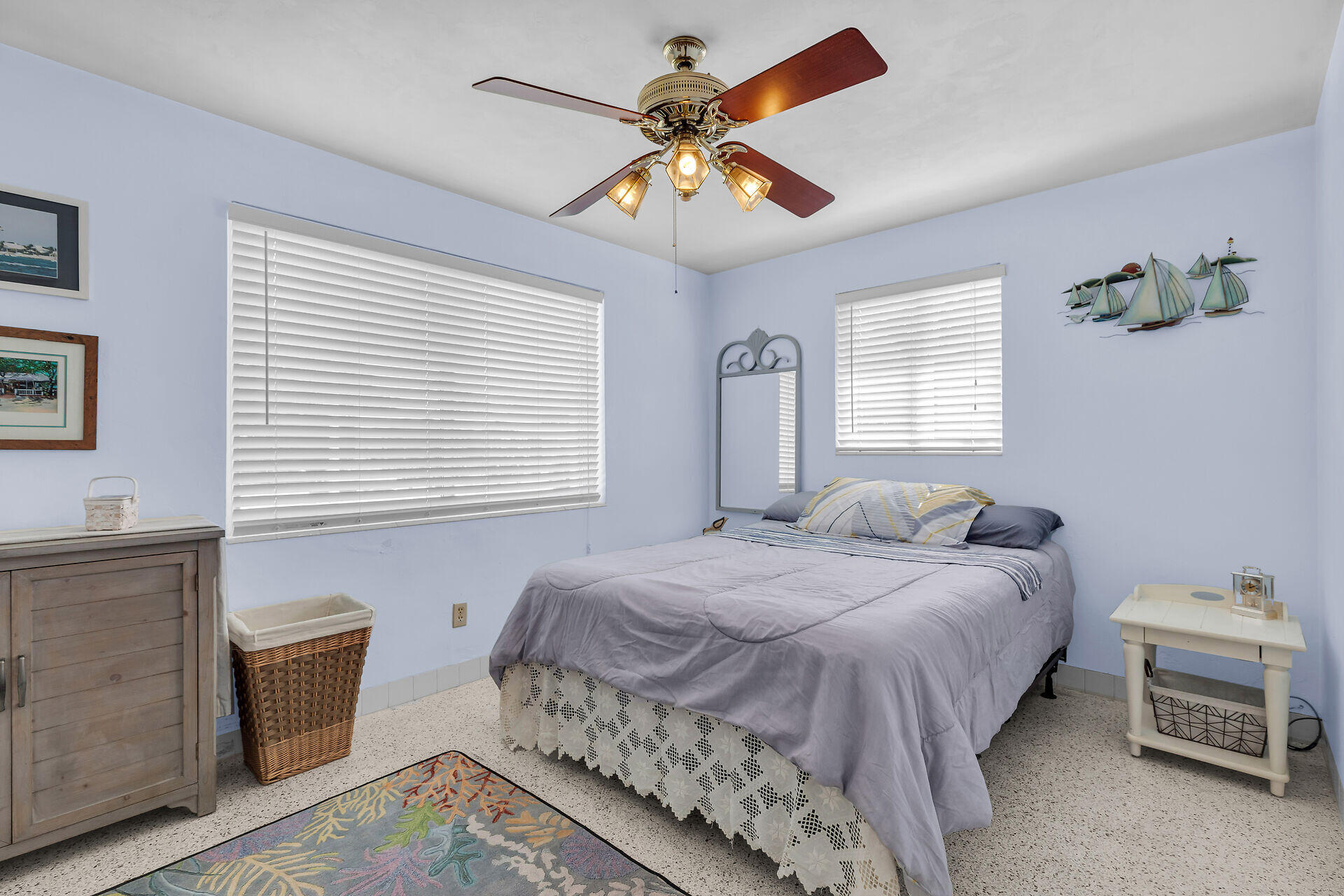 1014 17th Terrace Key West, FL 33040 - Photo 27 of 32 a bedroom with a bed and a chandelier