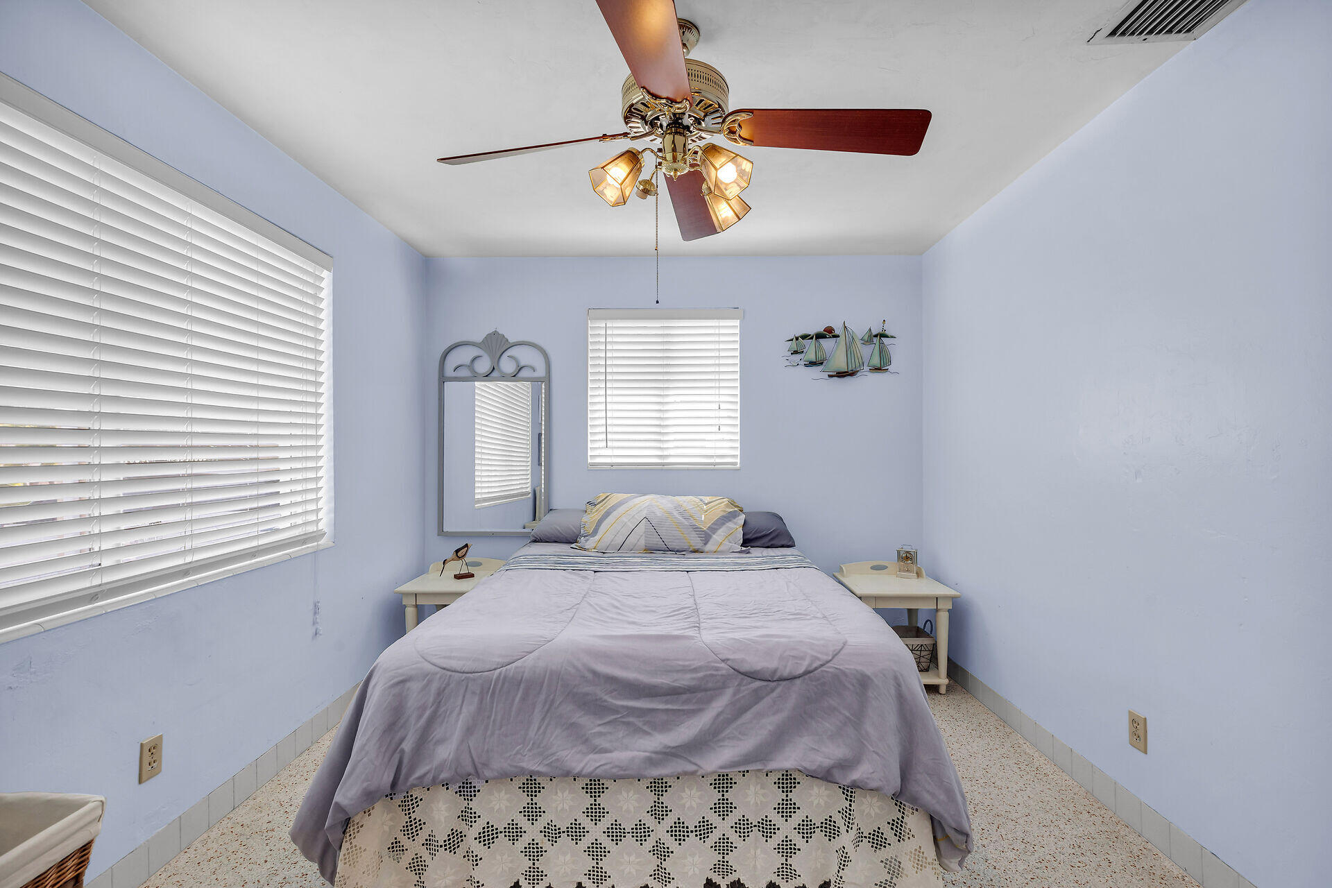 1014 17th Terrace Key West, FL 33040 - Photo 28 of 32 a bedroom with a bed and a chandelier