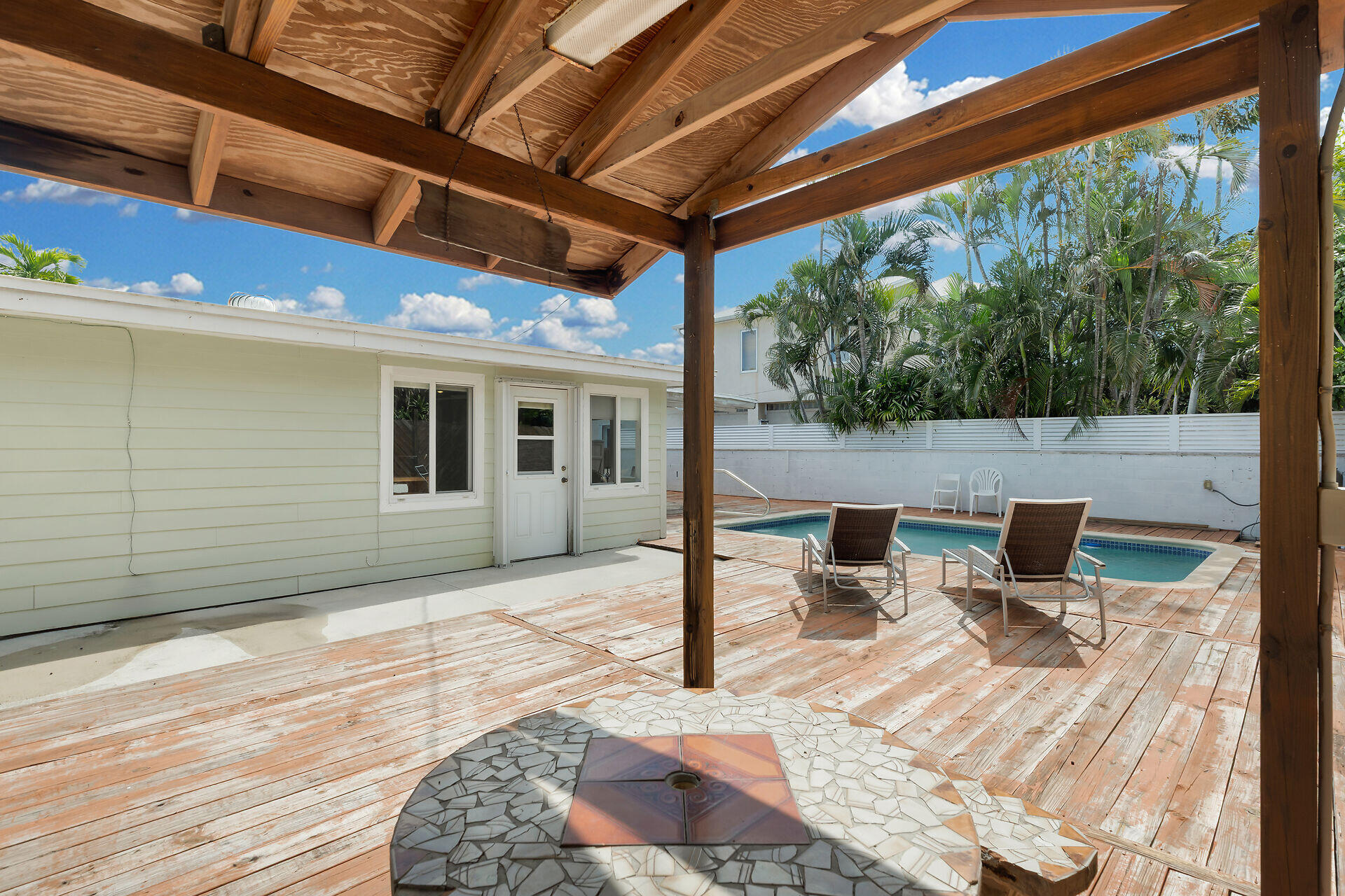 1014 17th Terrace Key West, FL 33040 - Photo 10 of 32 a outdoor space with the couches and dining table with wooden floor
