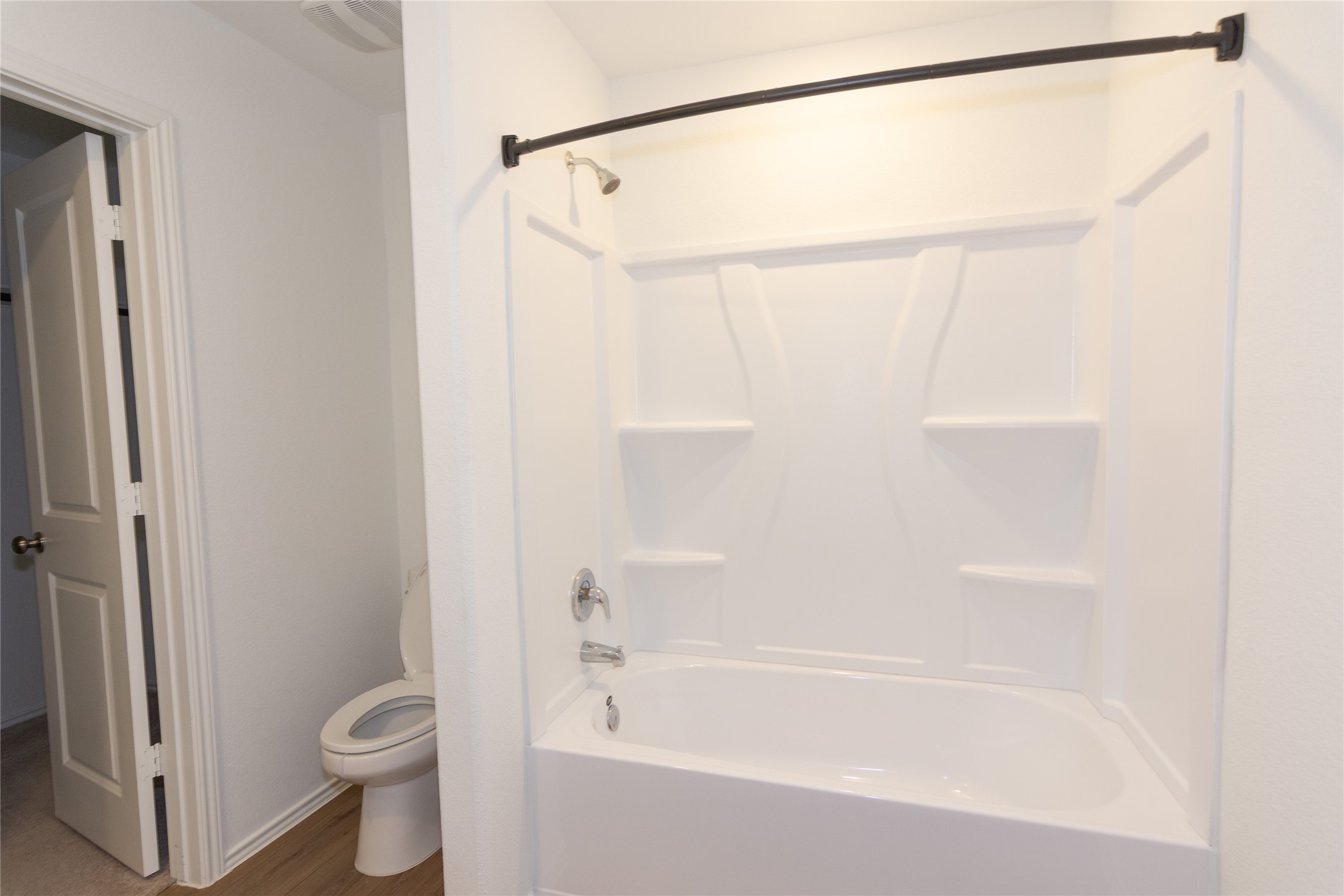 544 Rancho Del Cielo Loop Jarrell, TX 76537 - Photo 17 of 39 Full bath featuring shower / tub combination and dark wood-style flooring