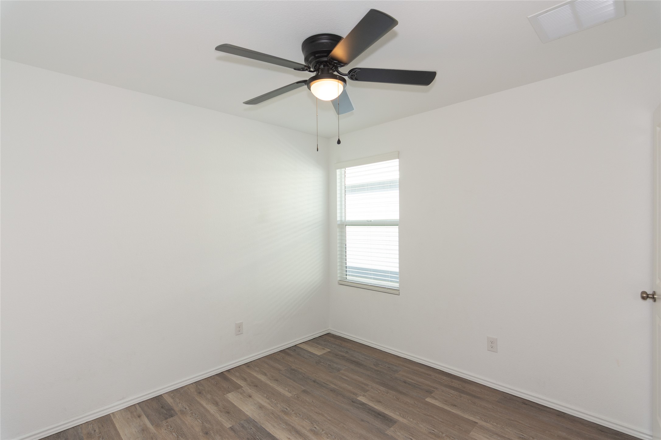544 Rancho Del Cielo Loop Jarrell, TX 76537 - Photo 21 of 39 Spare room featuring dark wood-type flooring and ceiling fan