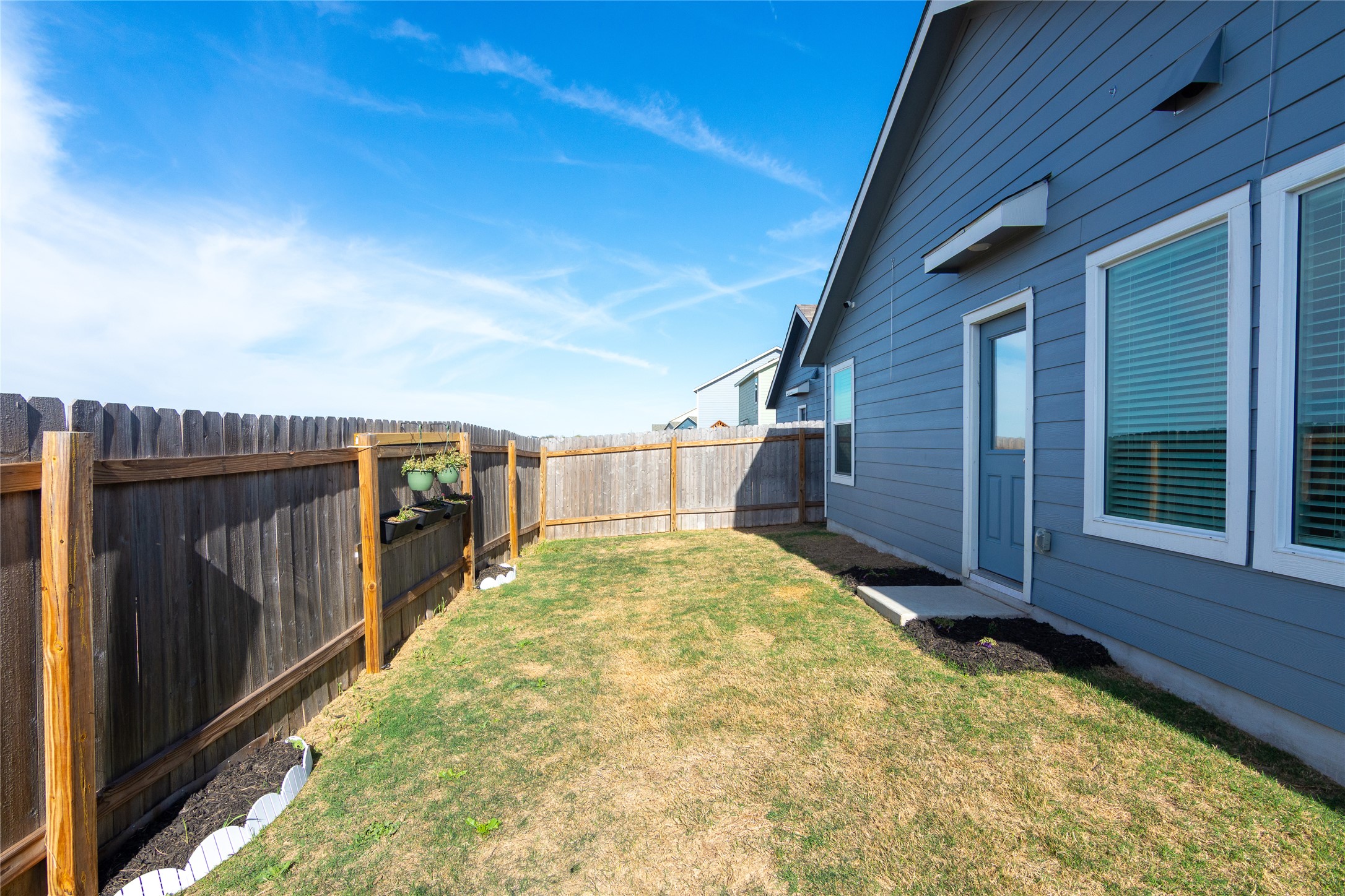 544 Rancho Del Cielo Loop Jarrell, TX 76537 - Photo 29 of 39 View of fenced backyard