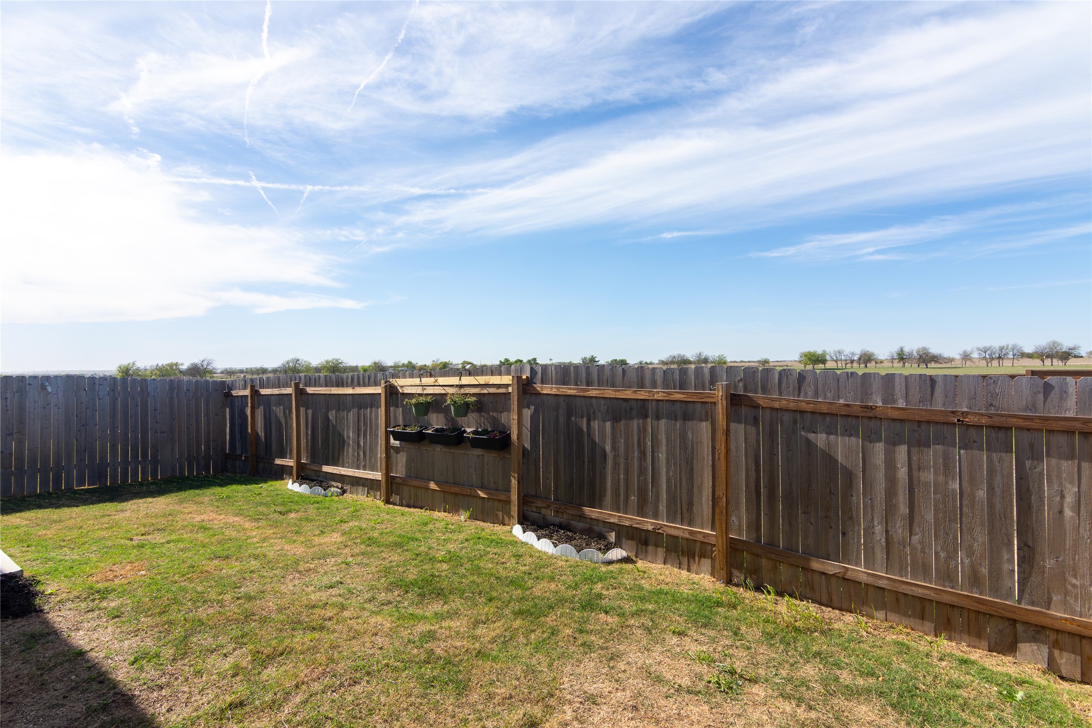 544 Rancho Del Cielo Loop Jarrell, TX 76537 - Photo 30 of 39 View of fenced backyard