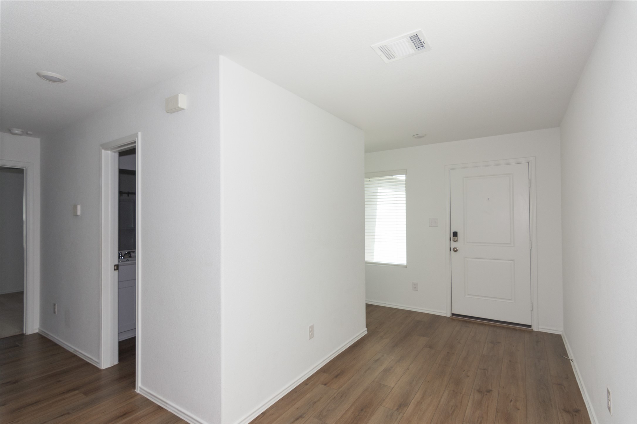 544 Rancho Del Cielo Loop Jarrell, TX 76537 - Photo 3 of 39 Entrance foyer featuring dark wood-style flooring