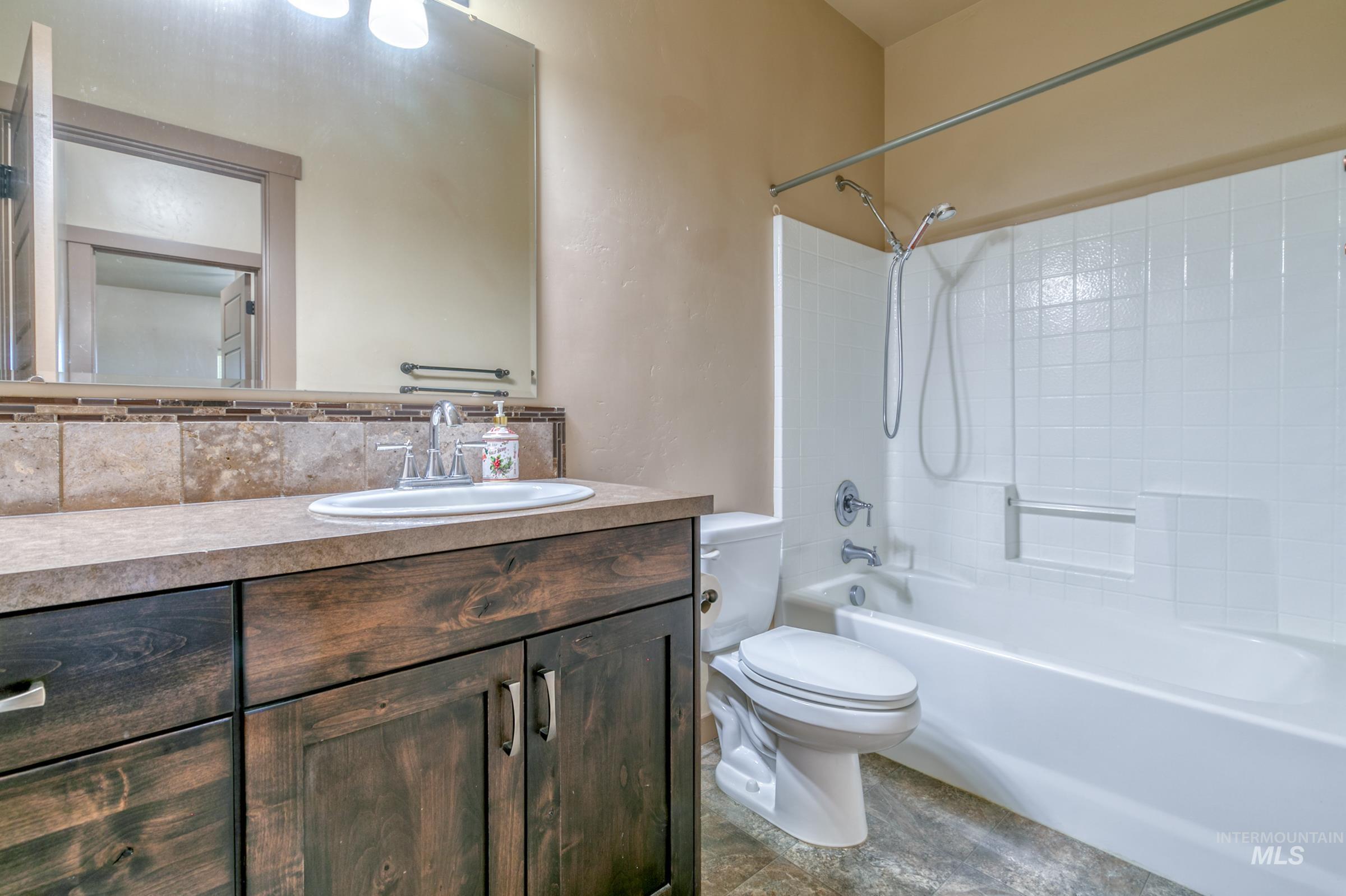 4316 Middlesboro Way Caldwell, ID 83607 - Photo 17 of 33 Recessed tray ceiling with crown molding and a ceiling fan