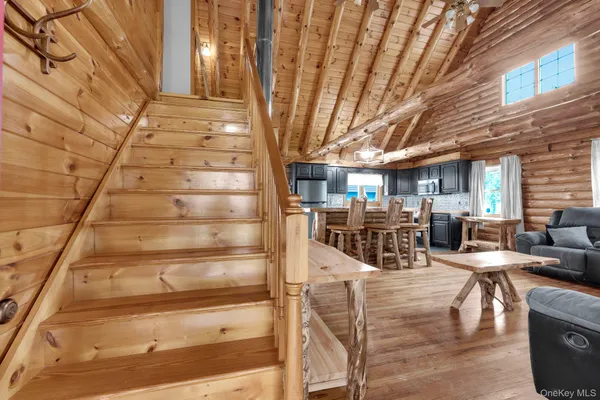 a view of entryway dining room and hall with wooden floor