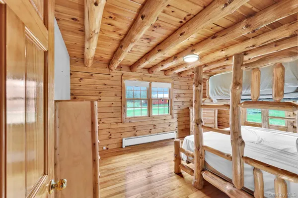 a view of an entryway with wooden floor and windows