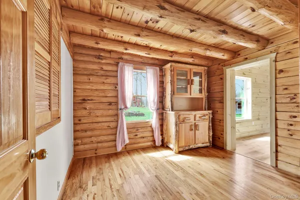 wooden floor in an empty room with a fireplace