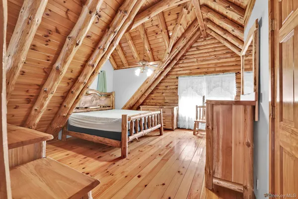 a view of entryway with wooden floor and stairs