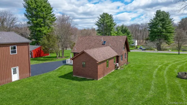 a aerial view of a house with backyard