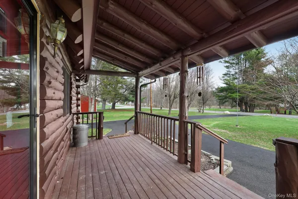 a view of balcony with wooden floor