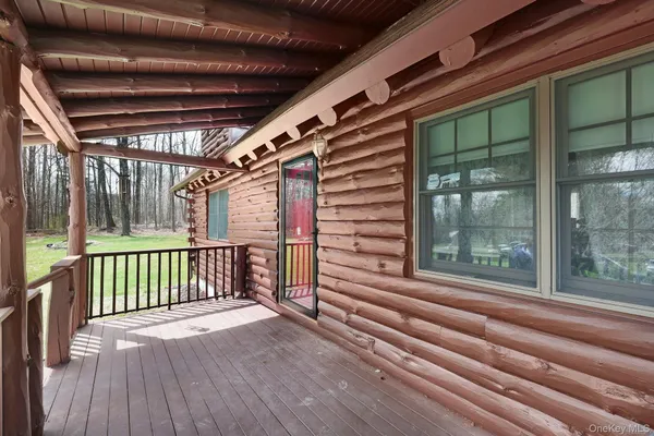 a view of backyard with porch and wooden floor