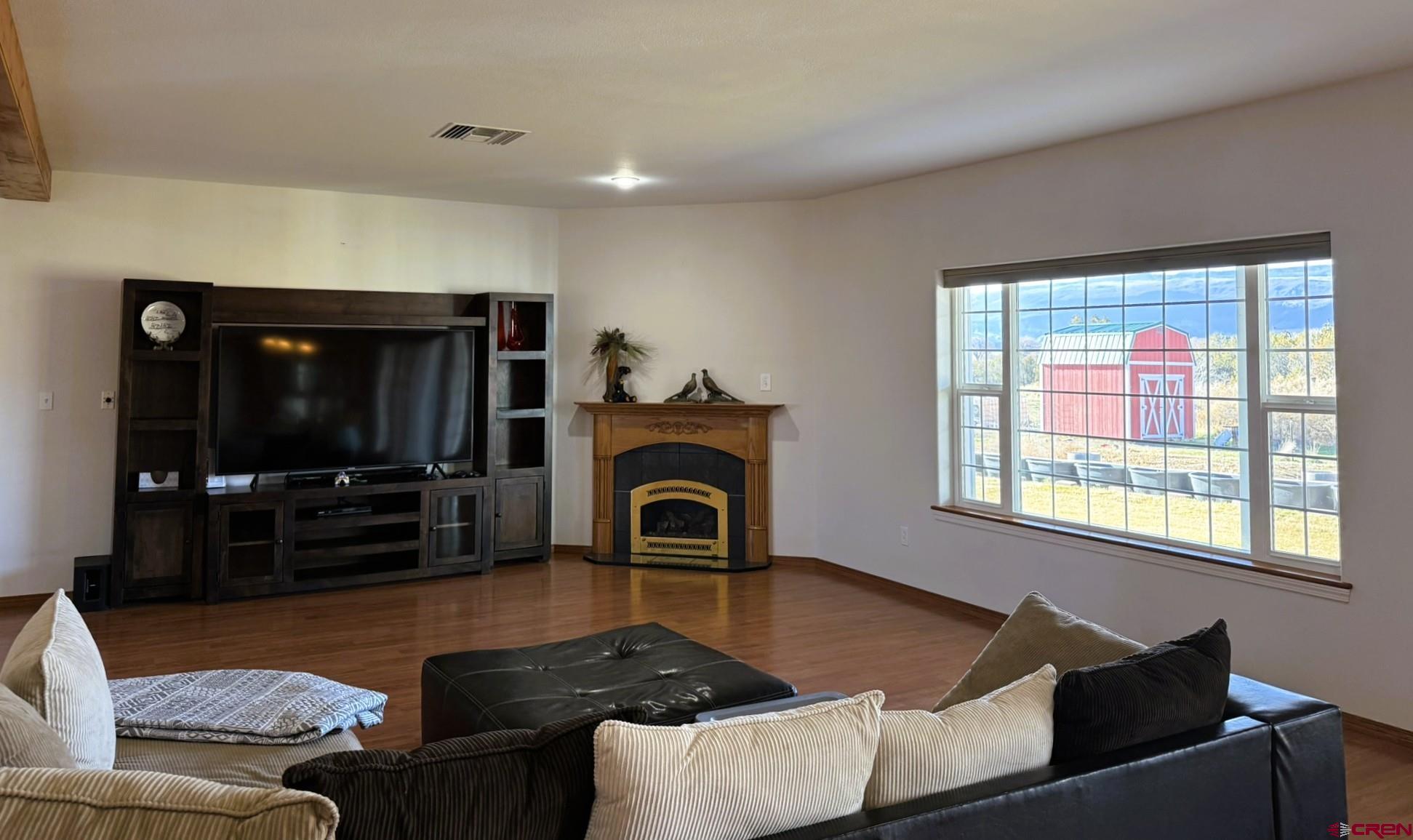 1552 Southwest Painted Fork Road Cedaredge, CO 81413 - Photo 11 of 45 a living room with furniture and a fireplace