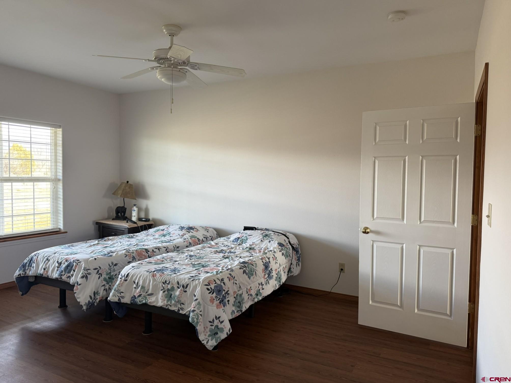 1552 Southwest Painted Fork Road Cedaredge, CO 81413 - Photo 12 of 45 a bedroom with a bed and a window