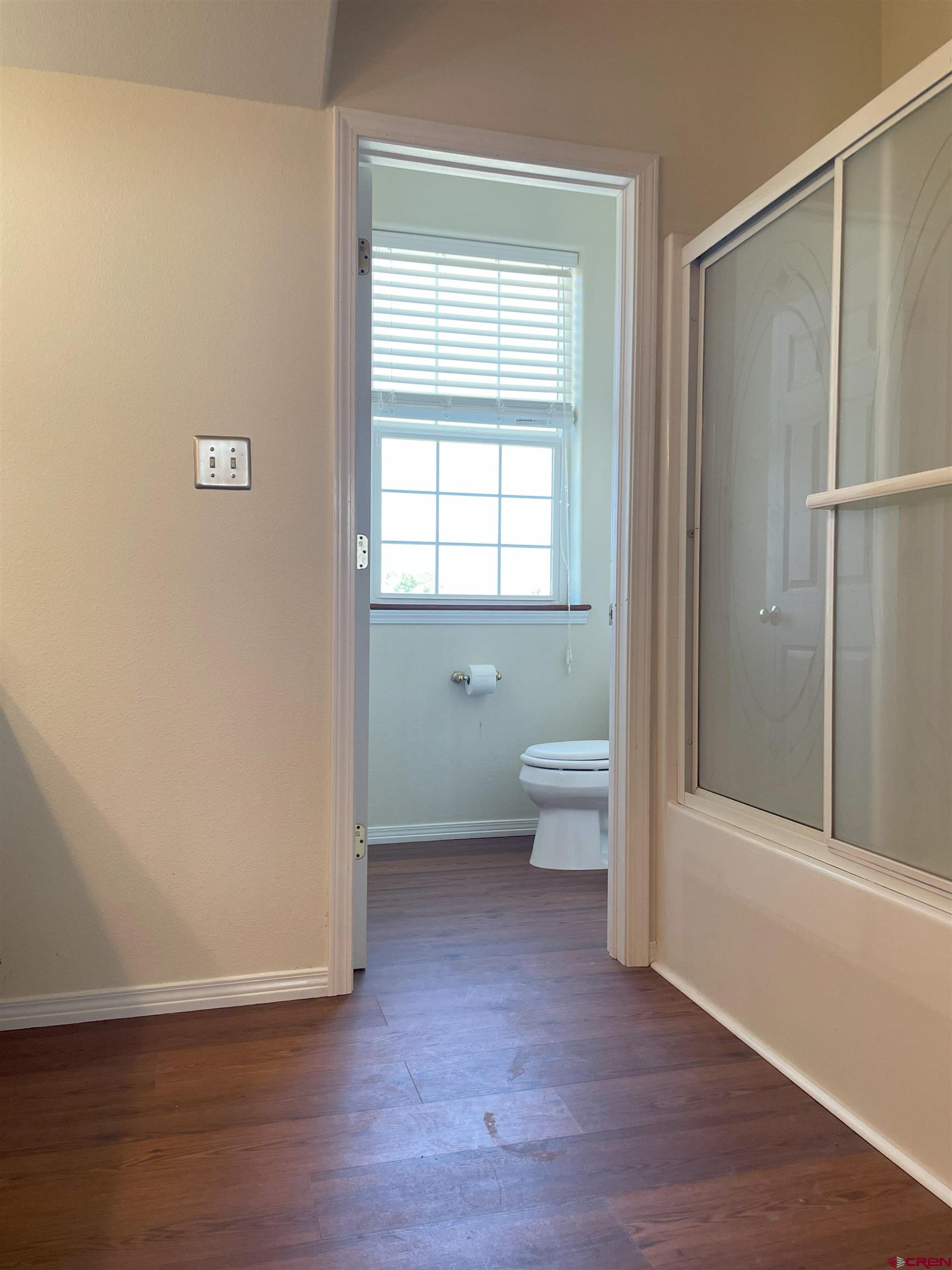 1552 Southwest Painted Fork Road Cedaredge, CO 81413 - Photo 17 of 45 a view of bathroom with bathtub and window