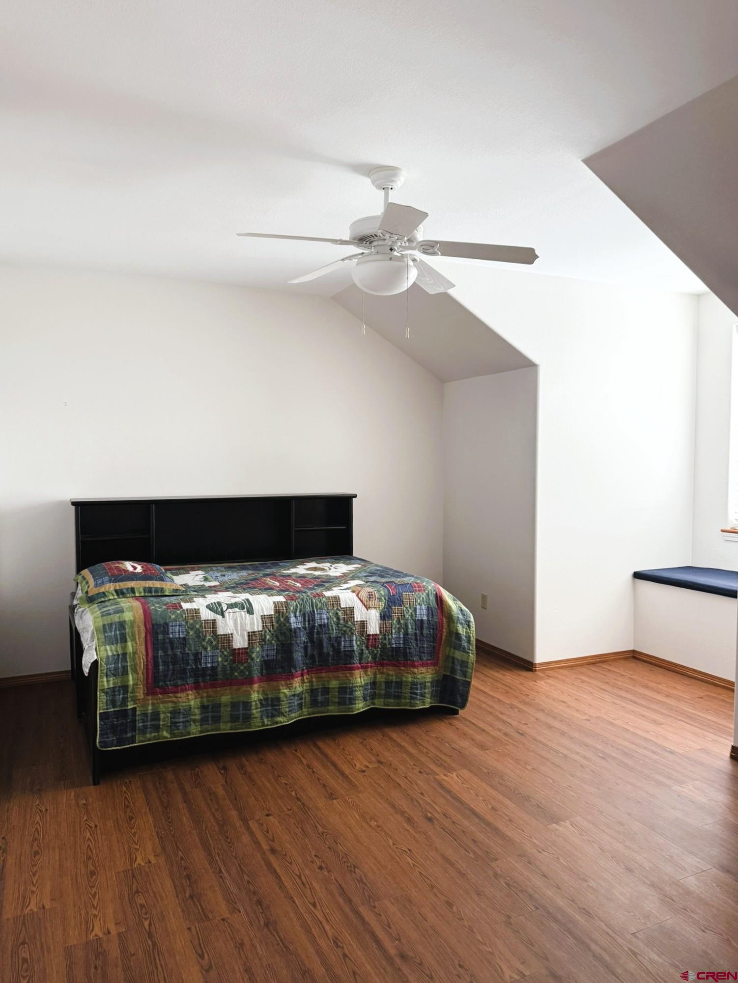 1552 Southwest Painted Fork Road Cedaredge, CO 81413 - Photo 18 of 45 a bedroom with bed and wooden floor