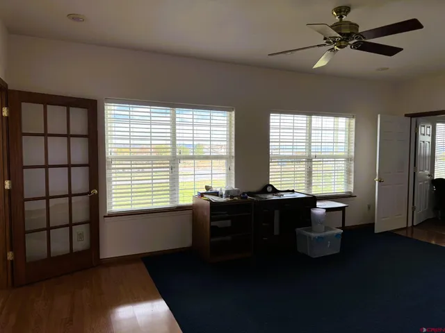 a bathroom with a granite countertop sink a toilet and a bathtub