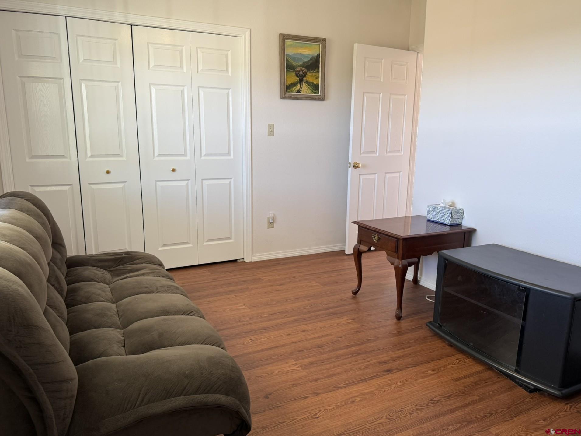 1552 Southwest Painted Fork Road Cedaredge, CO 81413 - Photo 24 of 45 a livingroom with furniture and wooden floor