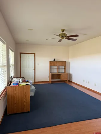 a bedroom with a bed and a flat tv screen