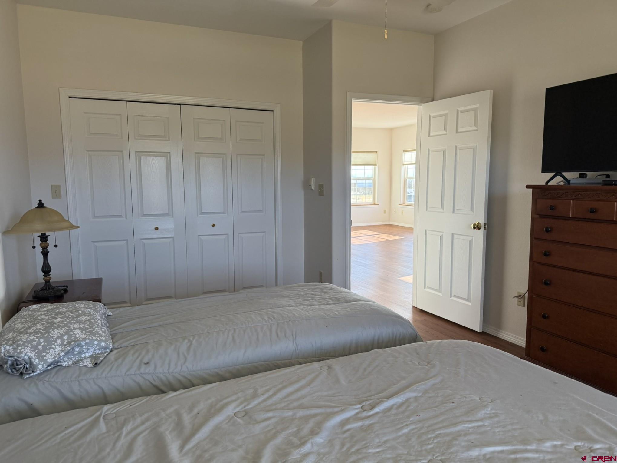 1552 Southwest Painted Fork Road Cedaredge, CO 81413 - Photo 28 of 45 a bedroom with a bed and a flat tv screen