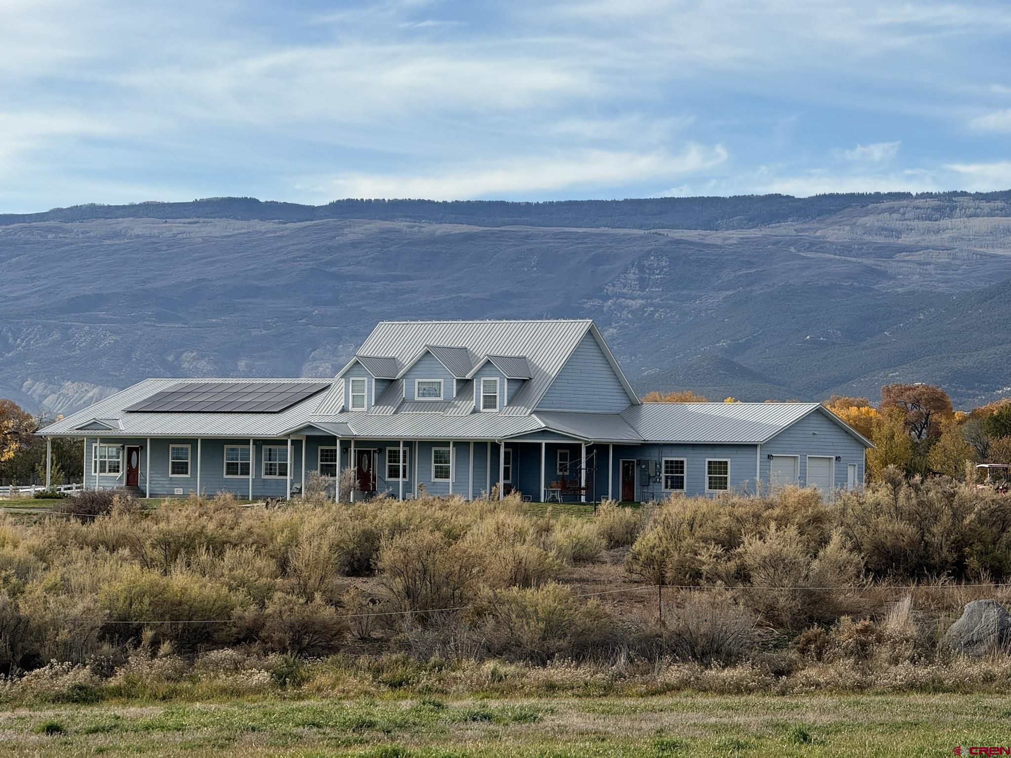 1552 Southwest Painted Fork Road Cedaredge, CO 81413 - Photo 35 of 45 a front view of house with yard and trees in the background