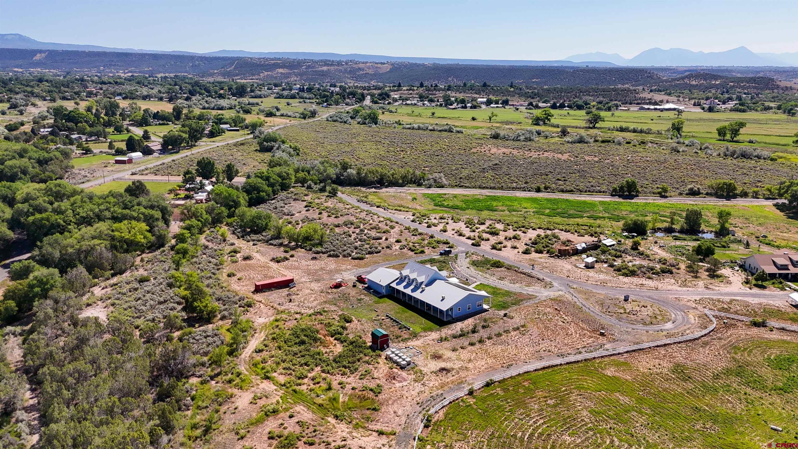 1552 Southwest Painted Fork Road Cedaredge, CO 81413 - Photo 4 of 45 an aerial view of a residential houses and outdoor space