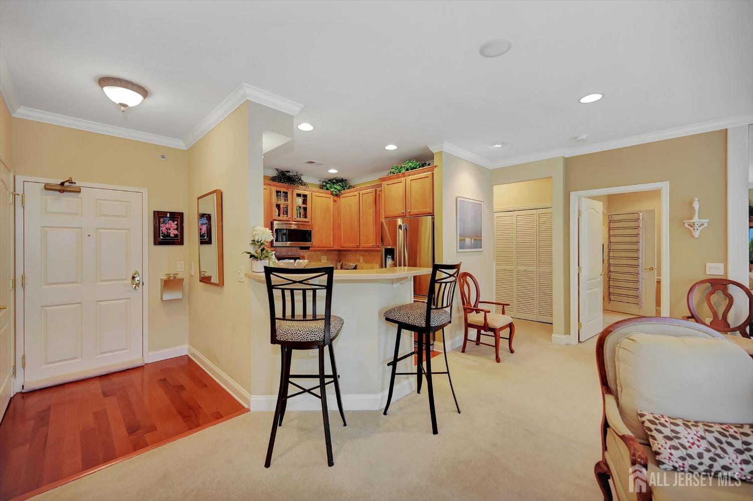 1322 Falston Circle Old Bridge, NJ 08857 - Photo 4 of 38 a living room with furniture kitchen view and a wooden floor