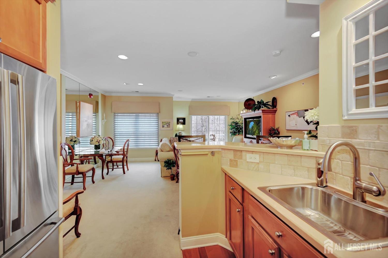 1322 Falston Circle Old Bridge, NJ 08857 - Photo 7 of 38 a kitchen with sink refrigerator and cabinets
